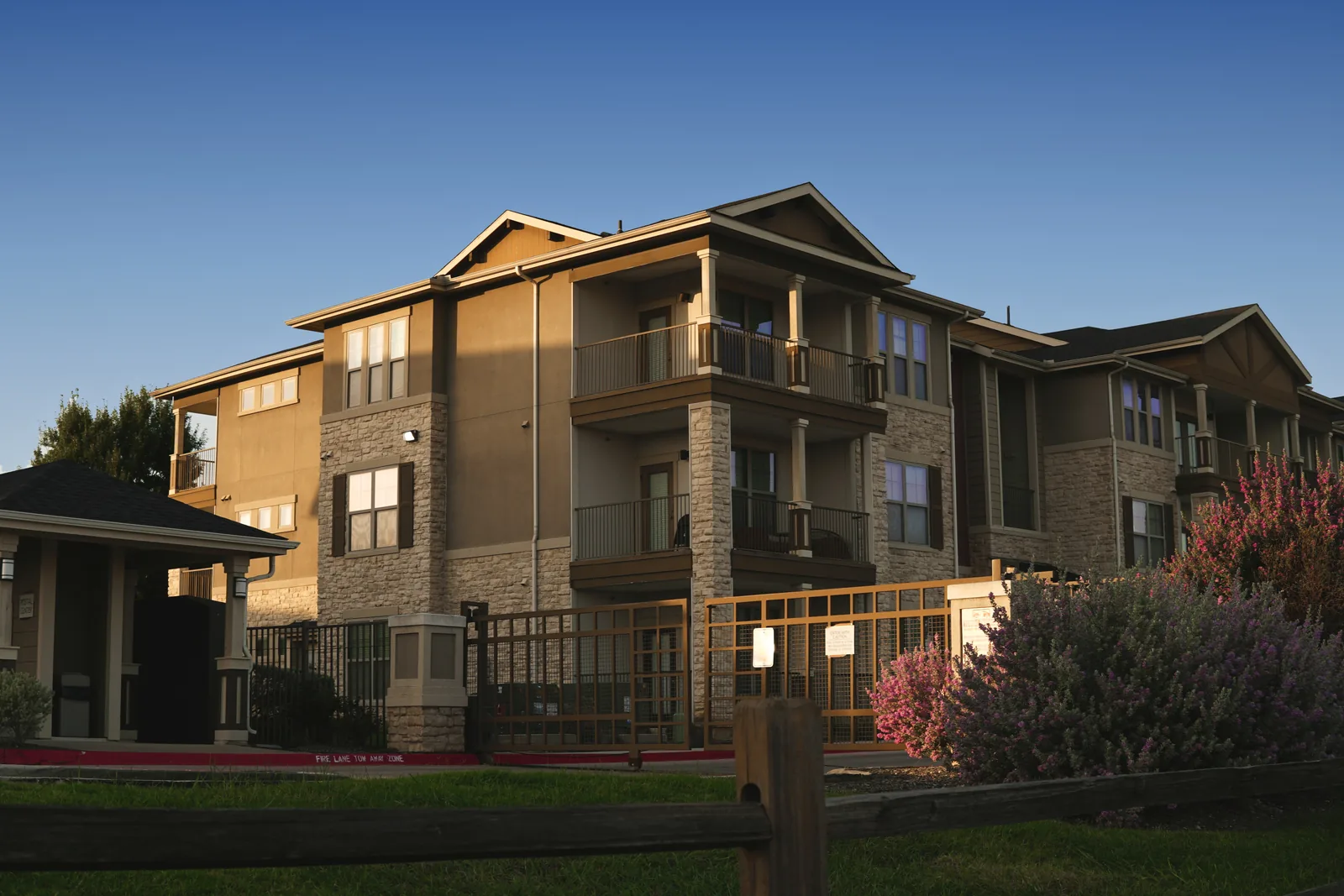 Newer three-story garden apartment community with balconies